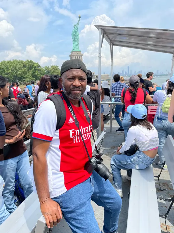 Portrait on a busy ferry with New York Harbor behind